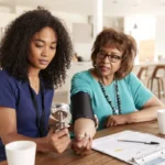 depositphotos 257798572 stock photo female healthcare worker checking blood